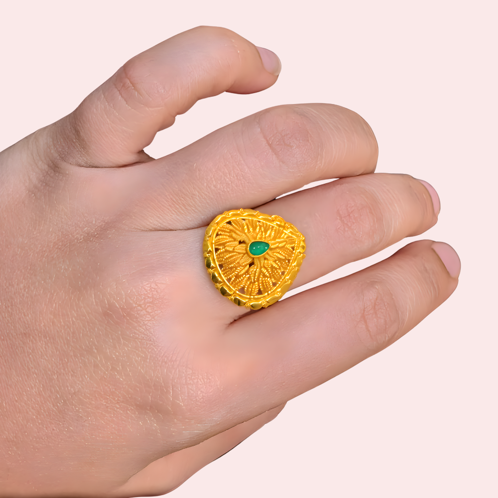 T0oBF6zbrQGuYB4lU4SYZVx46yYtz6Tn6VD8uzMI.png Traditional Sunburst Gold Finish Ring with Green Center Stone - Image 1